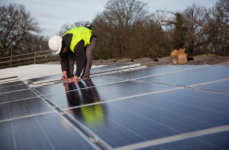 Solar panel installer on a barn roofSolar panel installer on a barn roof. CC BY 2.0 Possible