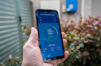 A man checks the charging status of a home installed battery sto