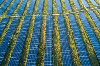 An aerial view of a solar farm set in the english countryside