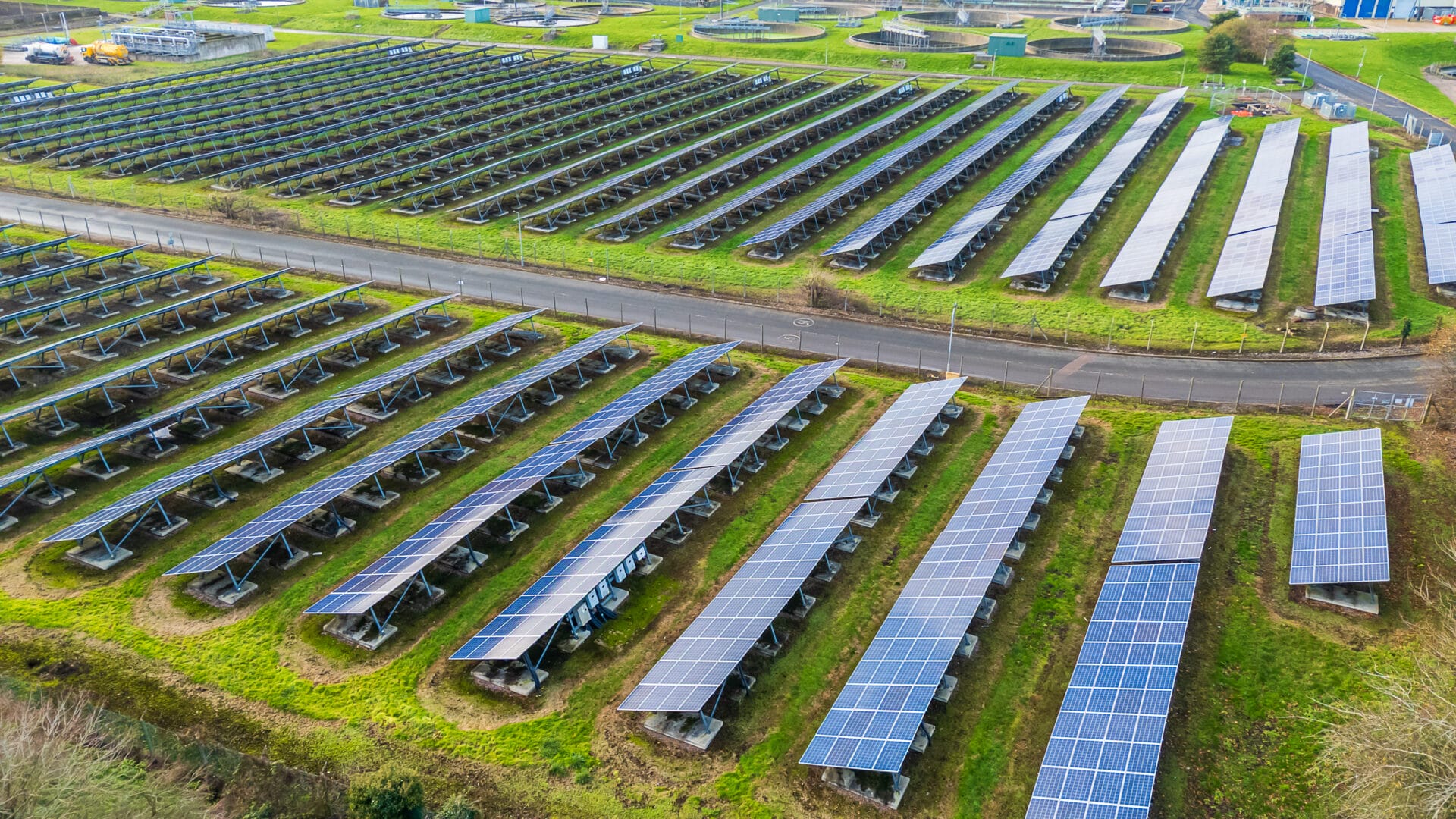 Solar photovoltaic panels from a 3/4 view from the side showing the stands holding them up at a Solar Farm in the West Midlands, UK